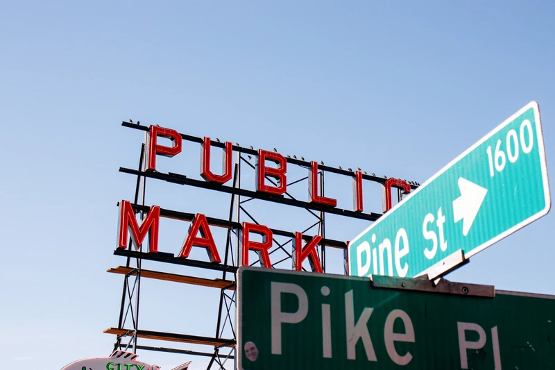 Public Market neon sign and Pine St street sign