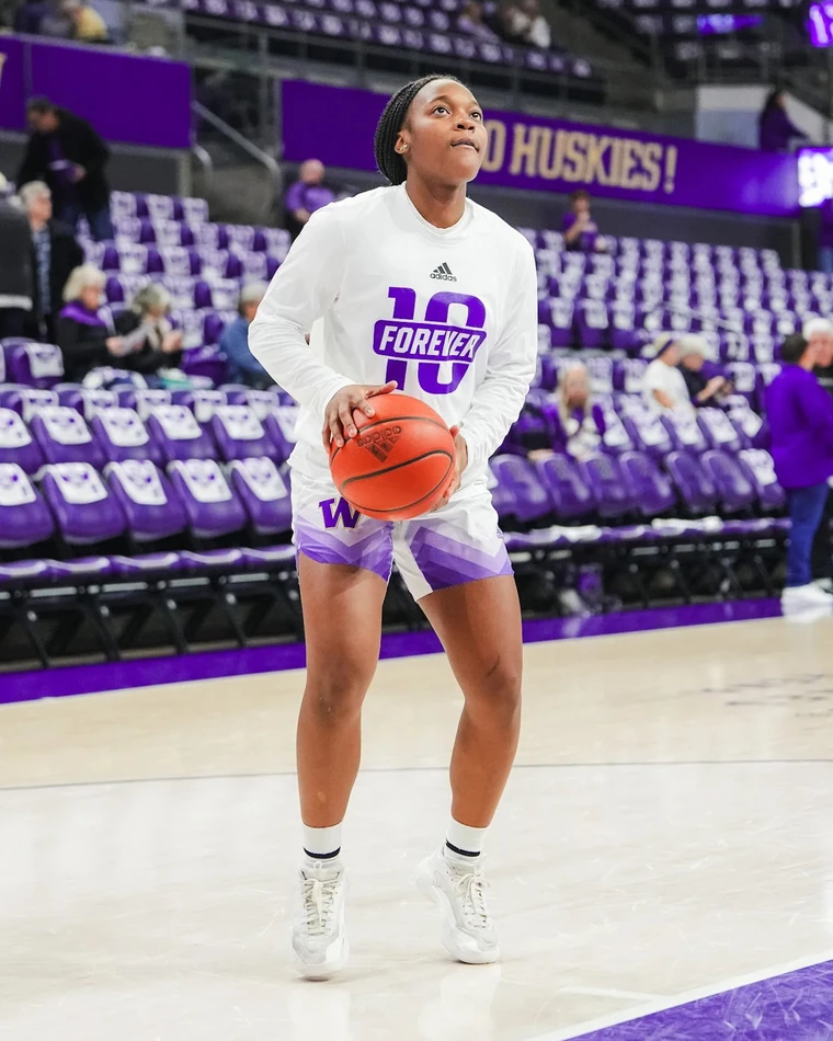 Sayvia Sellers in a Forever 10 warm-up long sleeve shirt