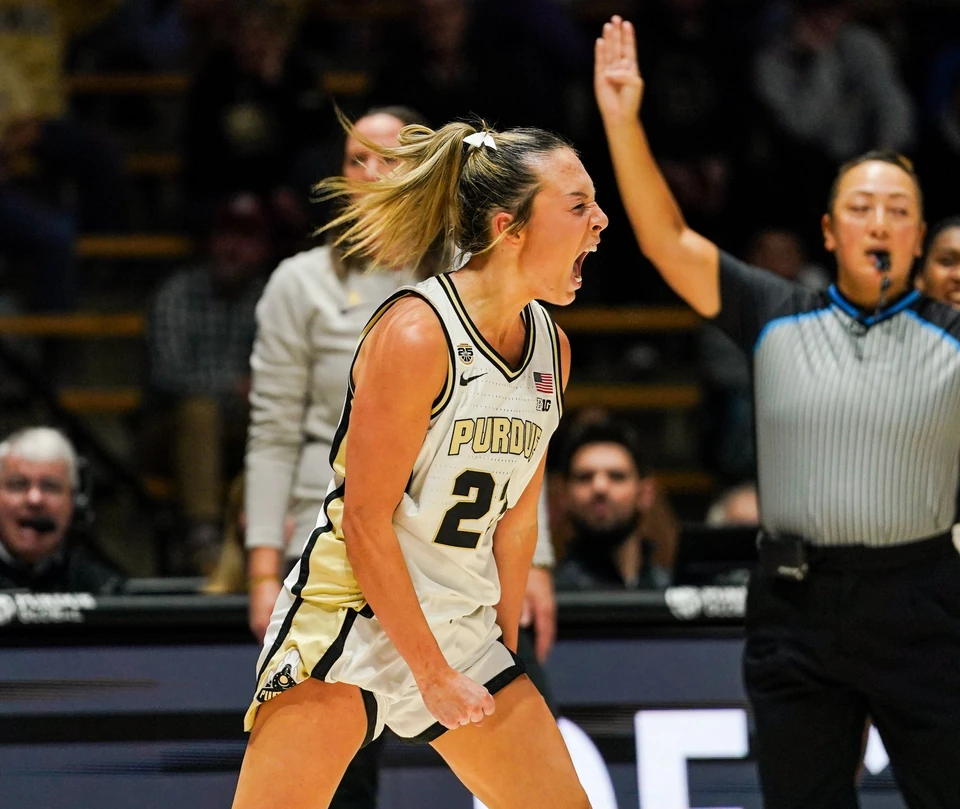 Purdue guard bringing the ball up the court