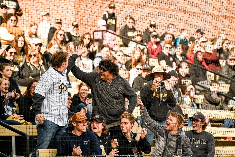 Purdue softball fans cheering in the stands