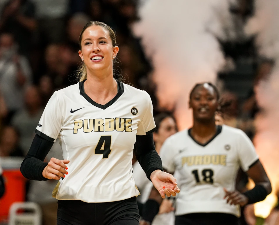 Purdue players running out through pyrotechnics