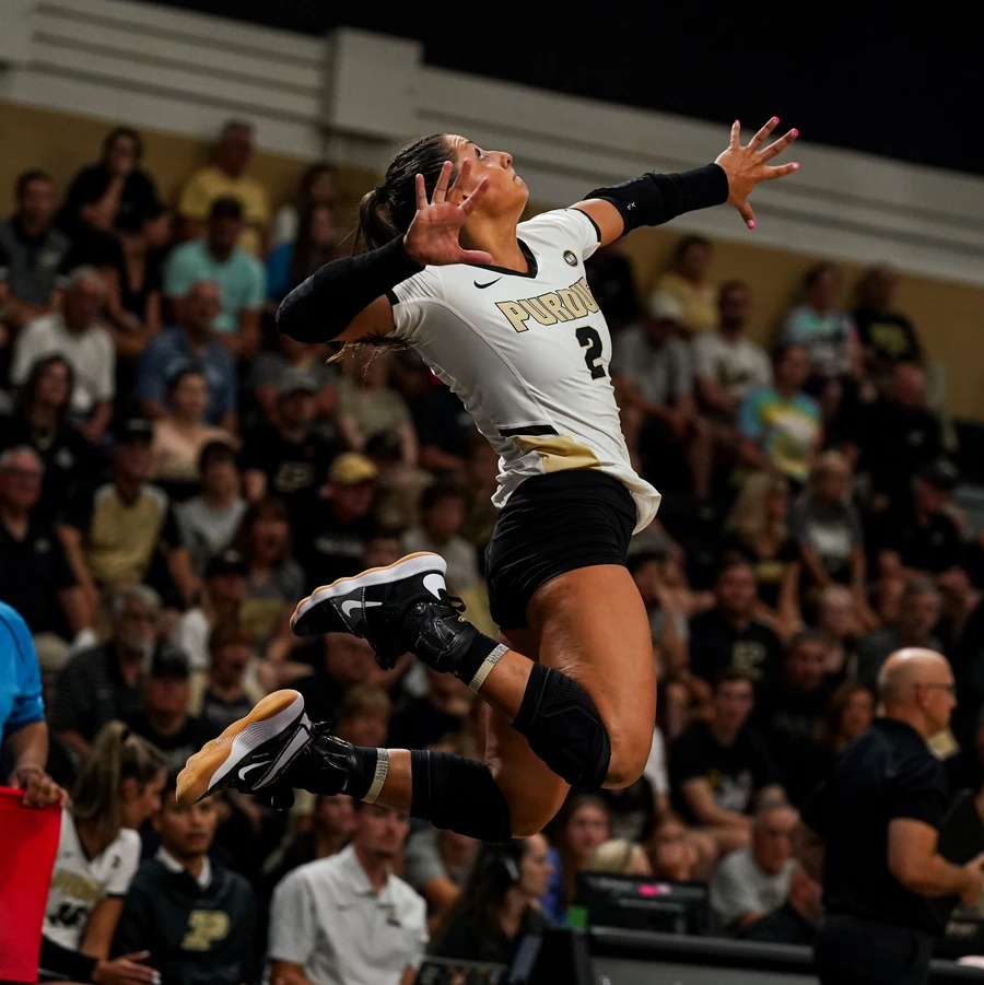Chloe Chicoine serving